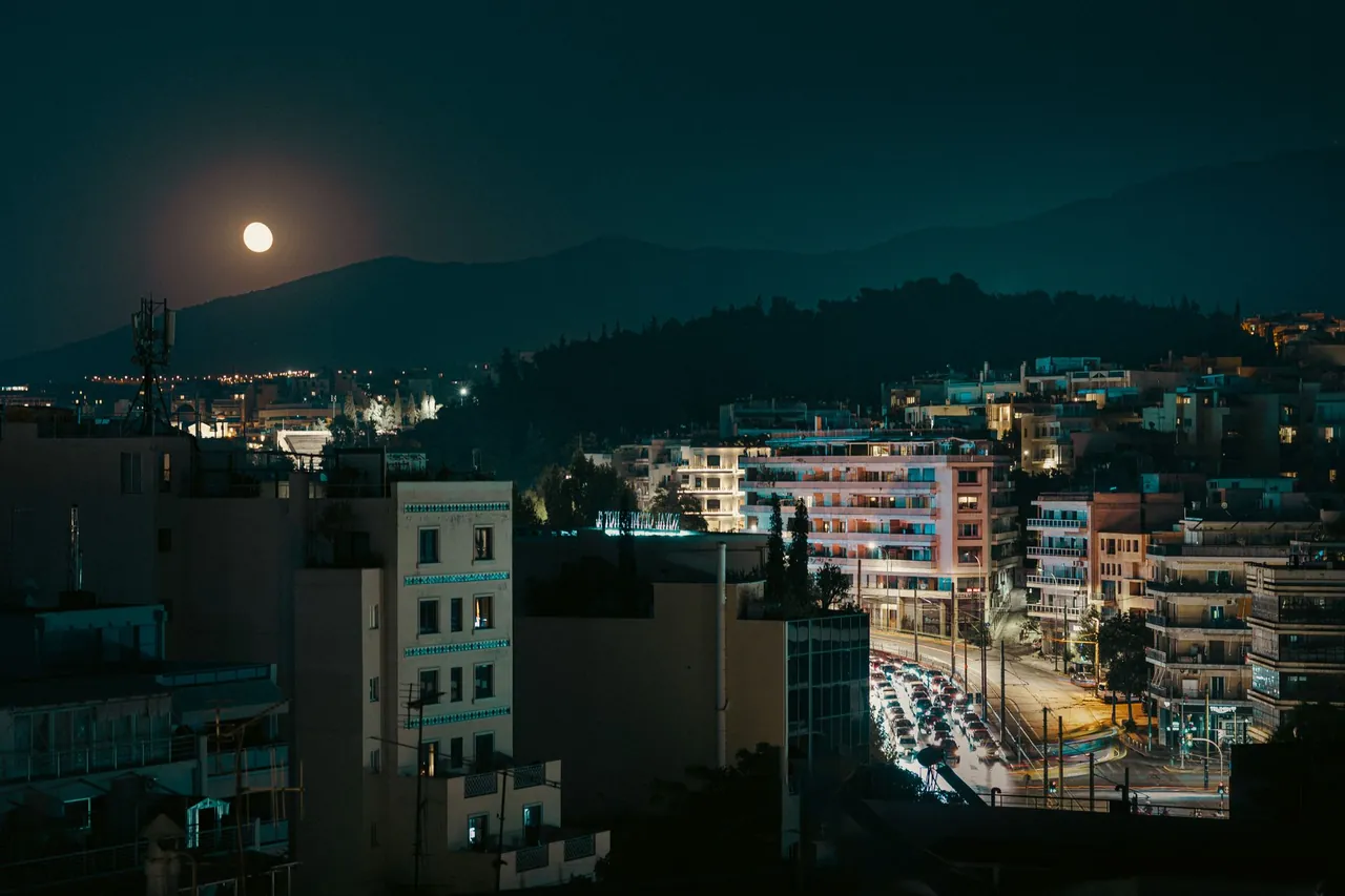 Lively Psiri neighbourhood street in Athens Greece at night with bars and string lights