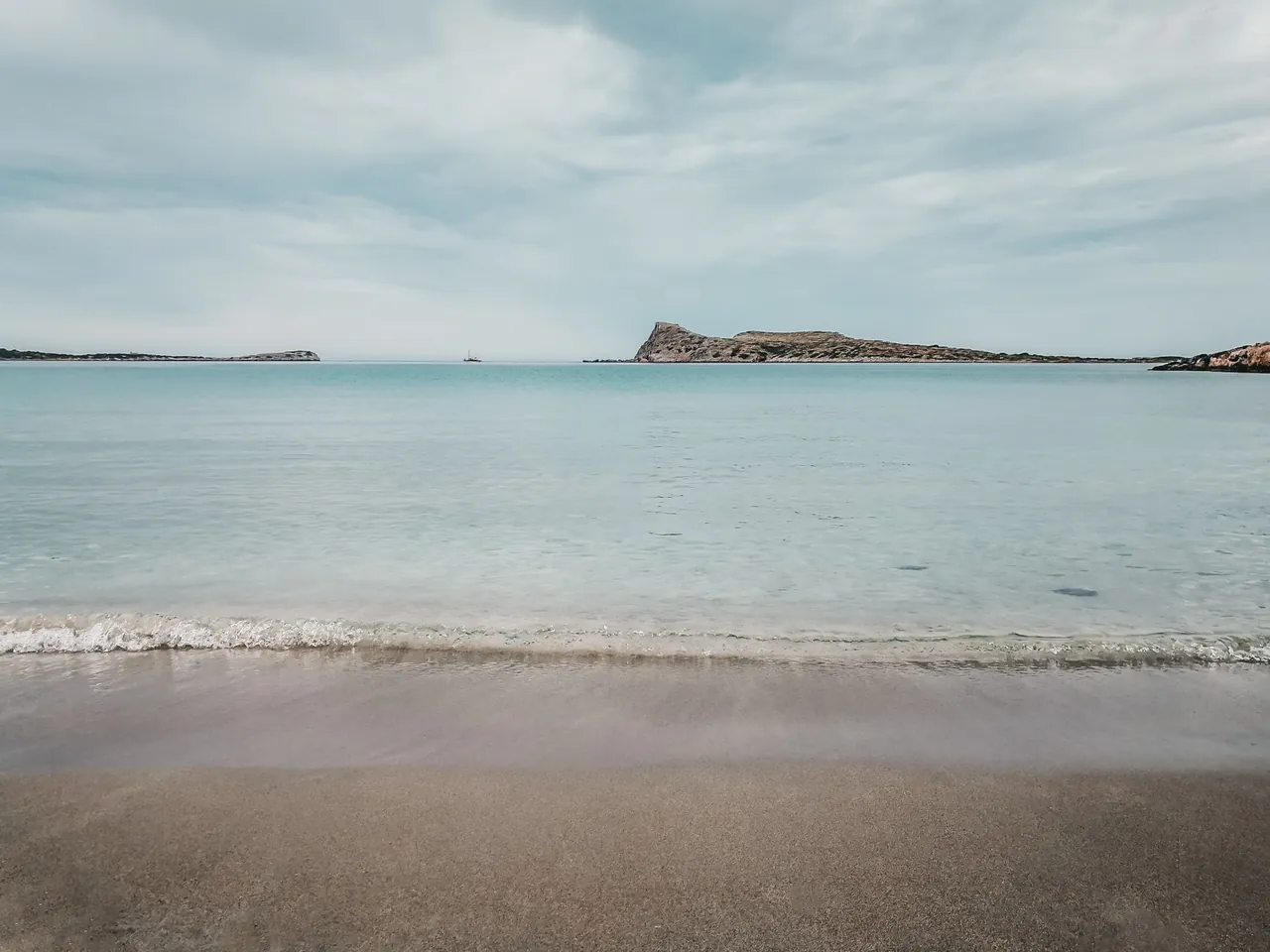 Elafonisi beach in southwest Crete, Greece, showing pink tinged sand and shallow clear water