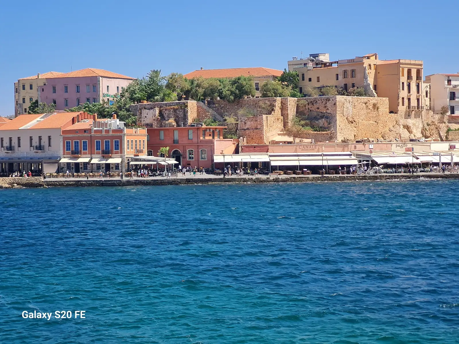 The Venetian harbour and old lighthouse in Chania, Crete, Greece at golden hour