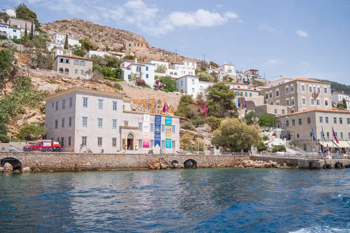The whitewashed houses of Hydra rising above the island's harbour, Greece