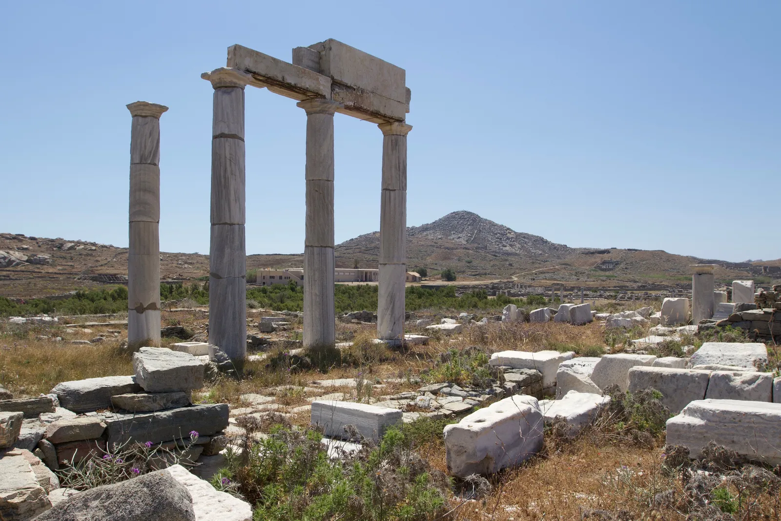 Ancient stone ruins and marble columns on the archaeological island of Delos