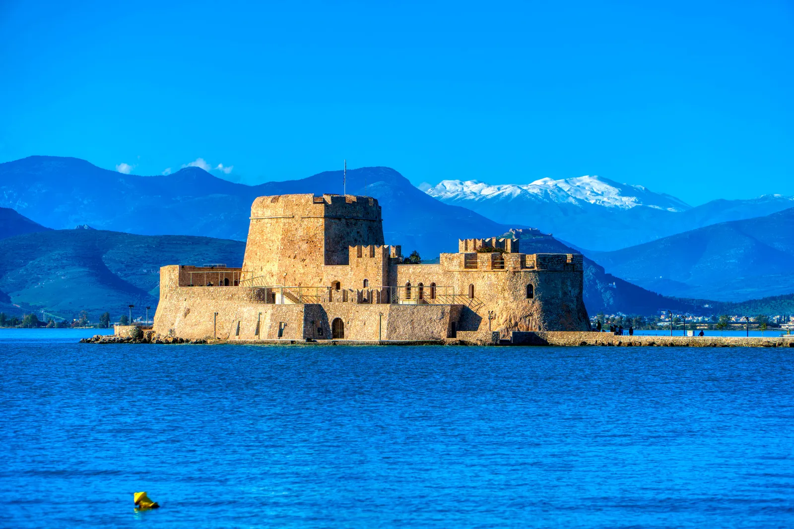 Nafplio old town waterfront with the Bourtzi fortress on its islet in the bay, Peloponnese, Greece