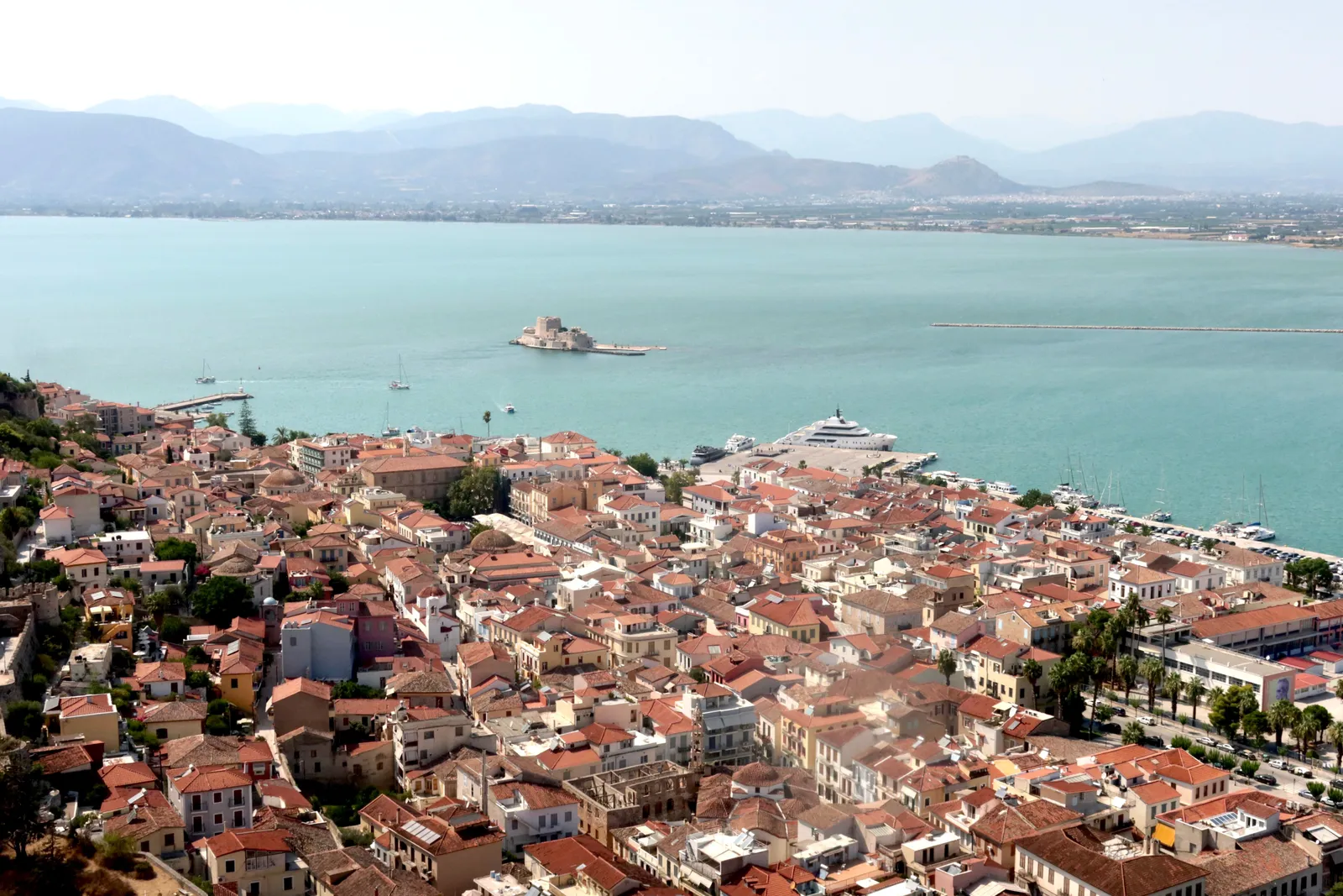 Bourtzi Venetian fortress on its islet in Nafplio harbour, Peloponnese, Greece, at golden hour