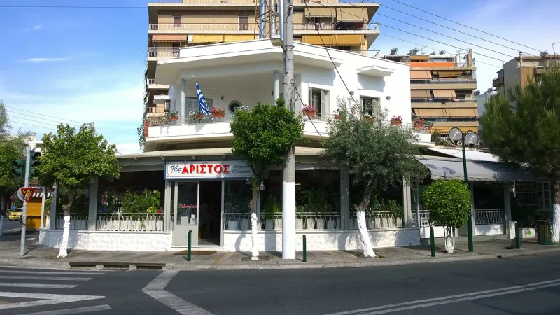 The front of Kyr Aristos in Athens, with its red sign above the entrance