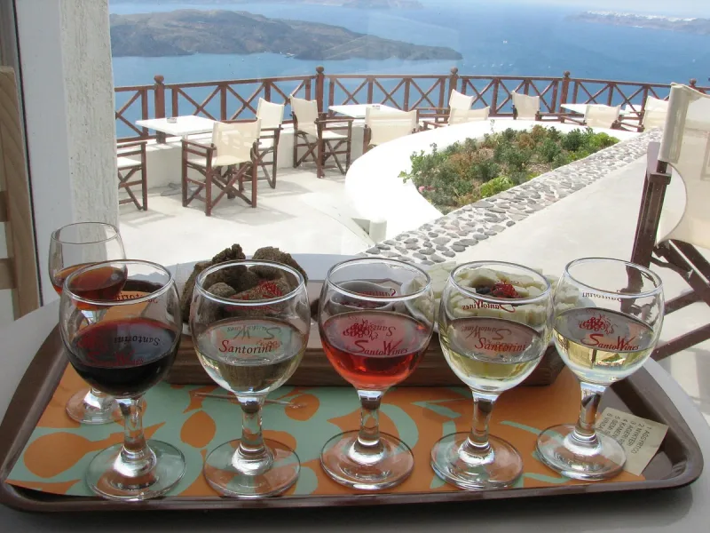 A wine tasting flight on a terrace table at Santo Wines in Santorini