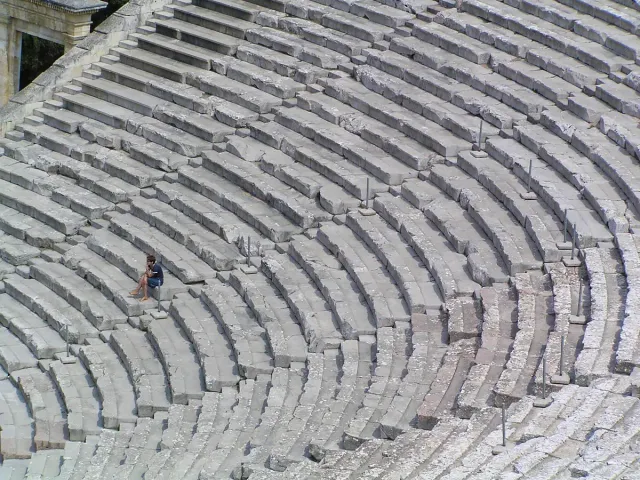 Tiered stone seating rows of a huge ancient theatre