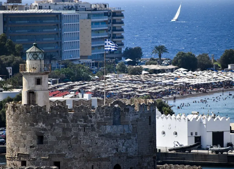 The battlement of St Nicholas fortress at Mandraki harbour, facing the Rhodes shoreline